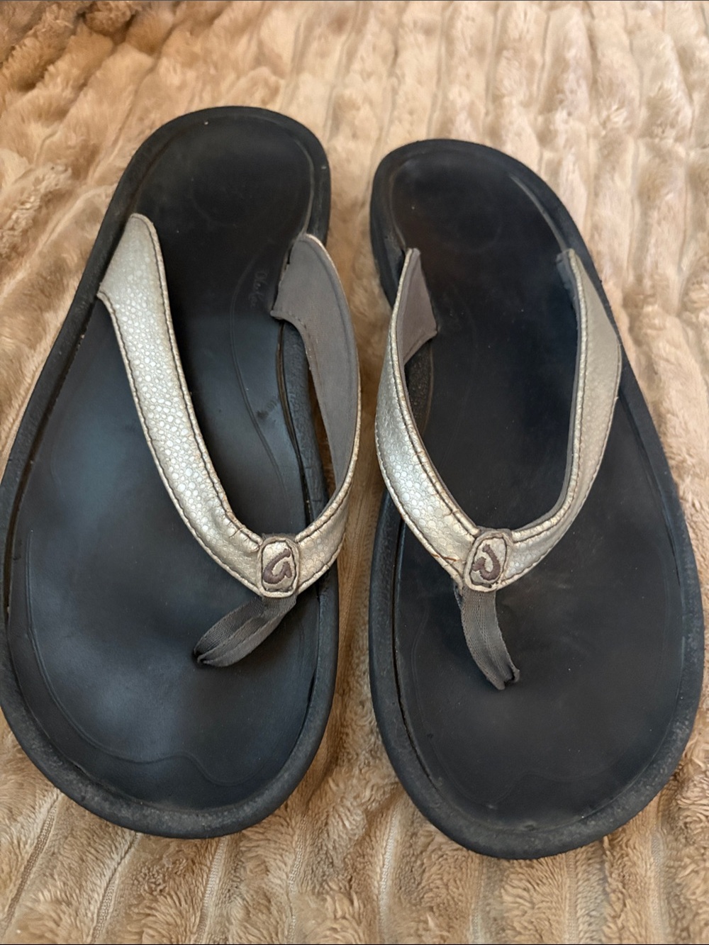 OluKai Black Footbed with Metallic Silver Straps Sandals
